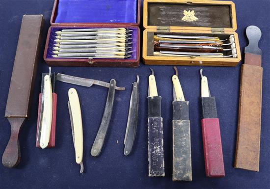 A collection of cut throat razors some cased and strops